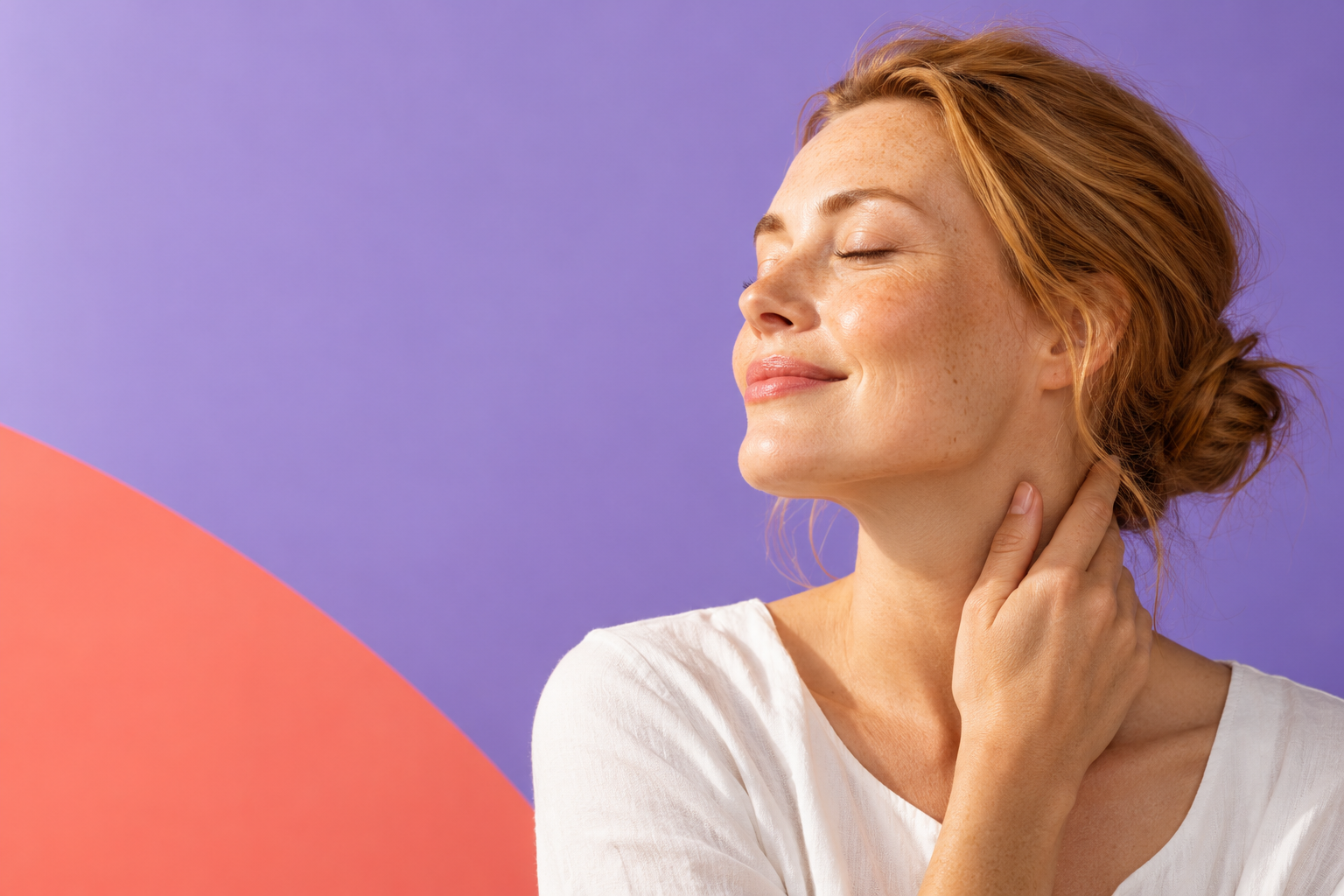 Woman with her eyes closed touching her neck, lavender and coral background