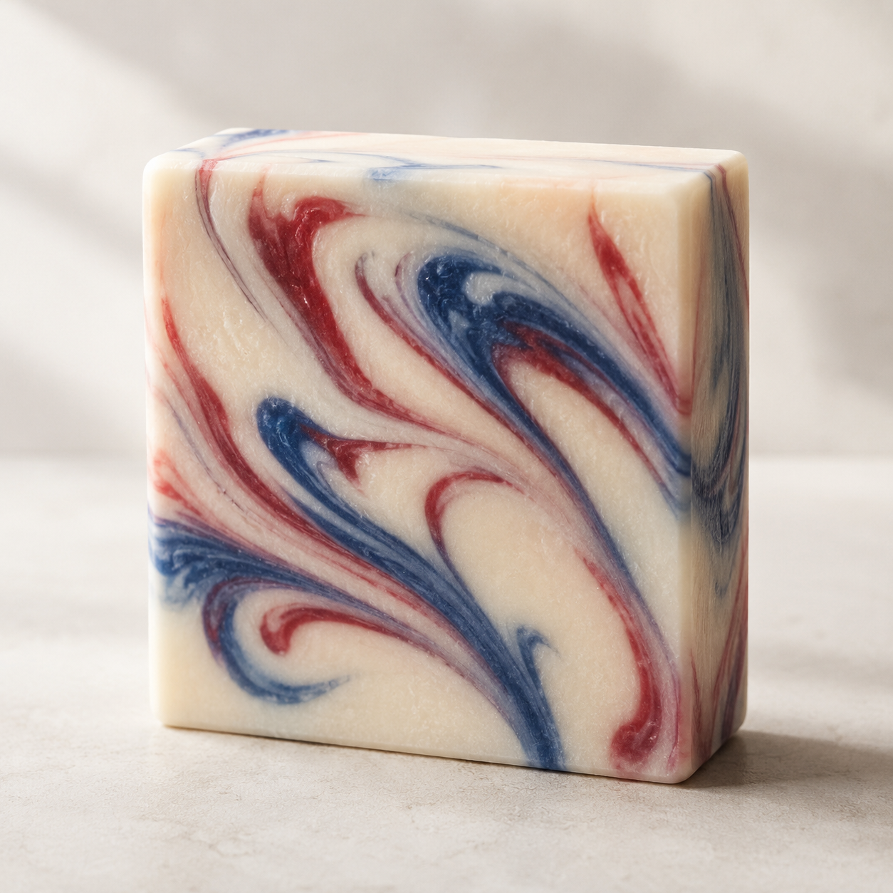 Tyme 1776 red-white-and-blue goat's-milk swirl bar, studio close-up